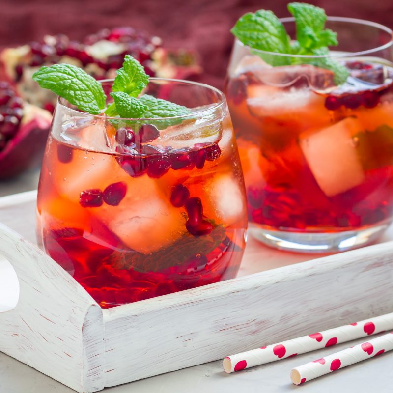 mojito-cocktail-with-pomegranate-mint-lemon-juice-and-ice-in-glass-square.jpg